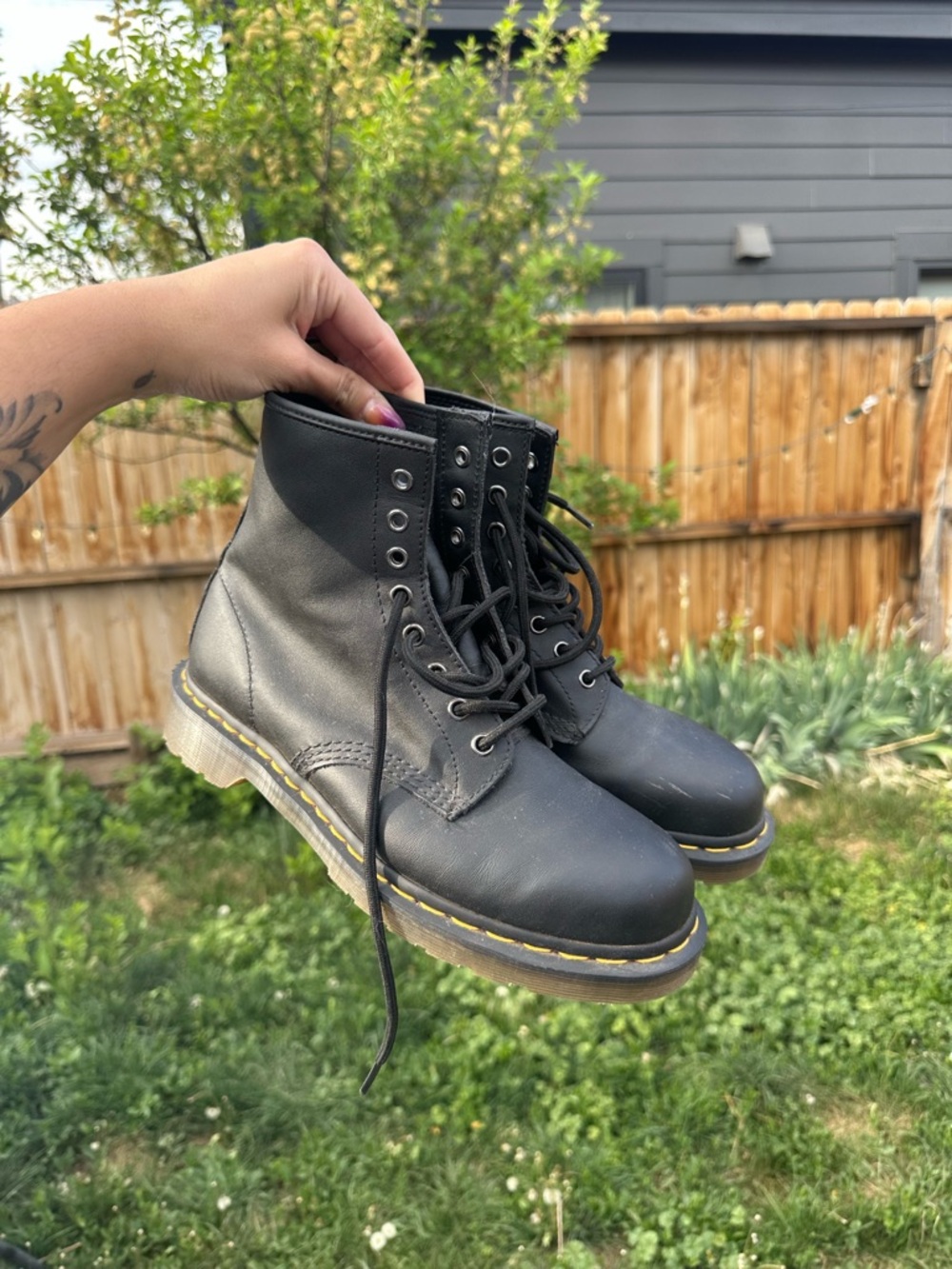 Dr. Martens Black Leather Boots with Yellow Logo Detail